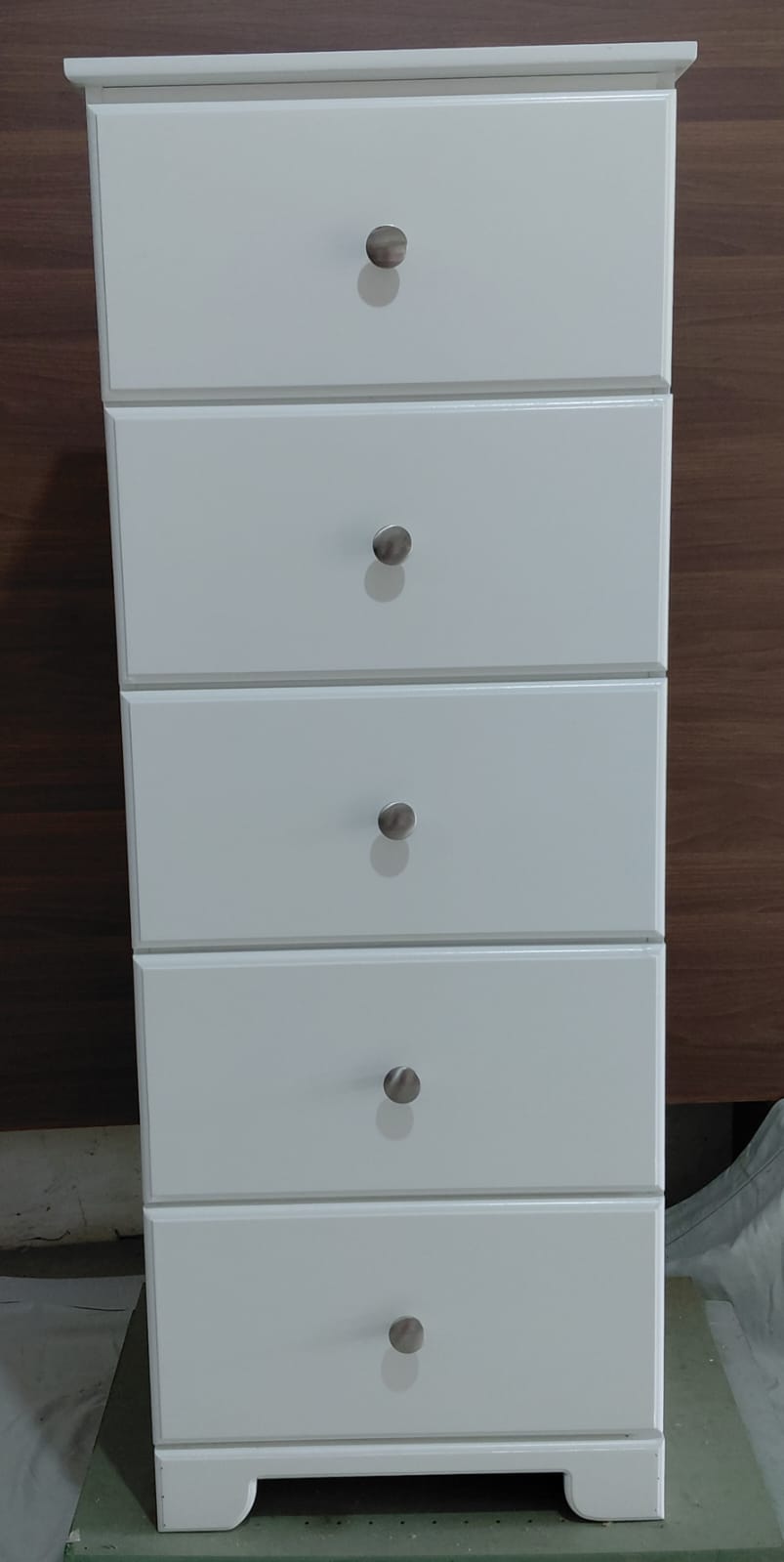 Tall white five-drawer chest, straight-on view