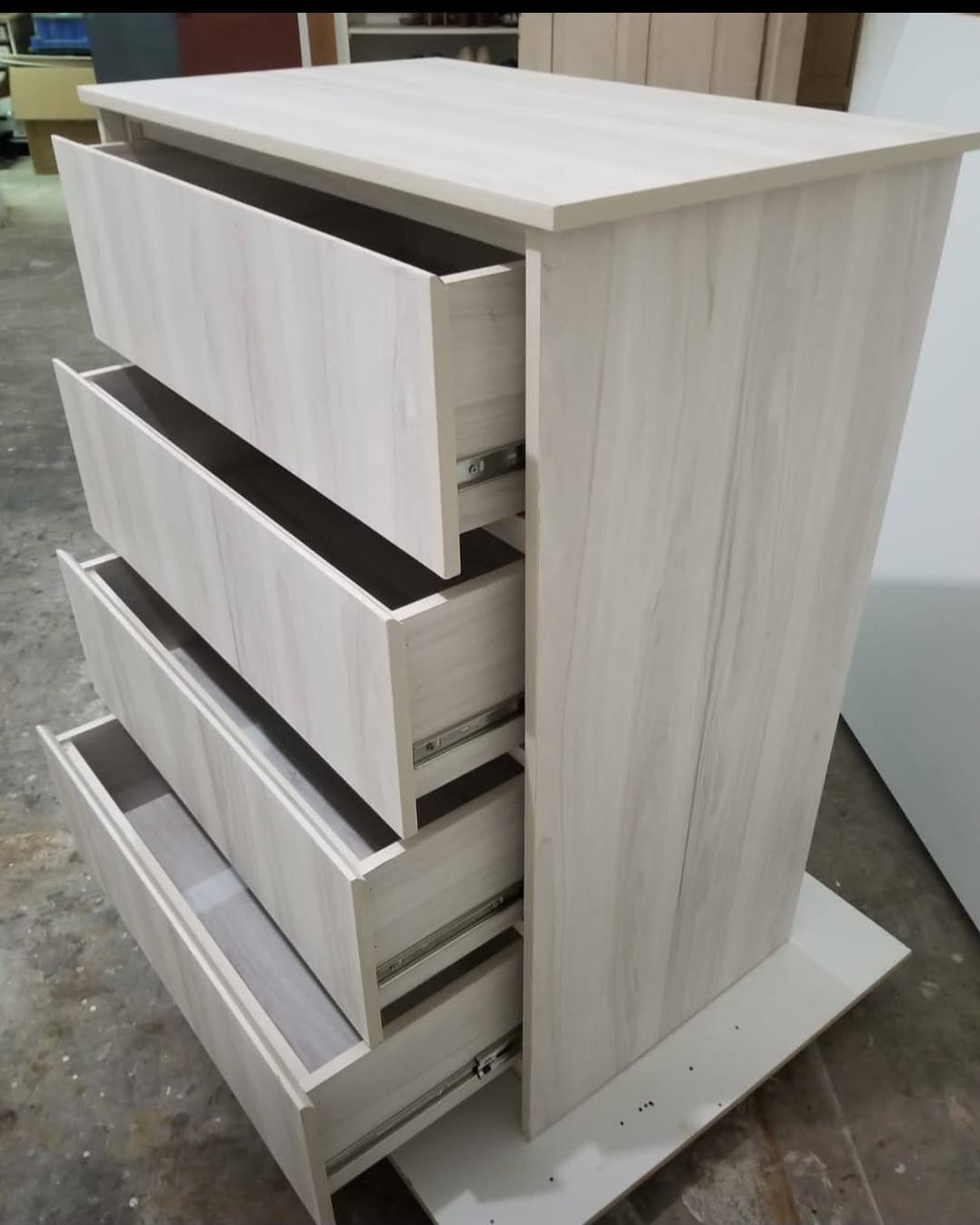 Light oak dresser, drawers open, angled view