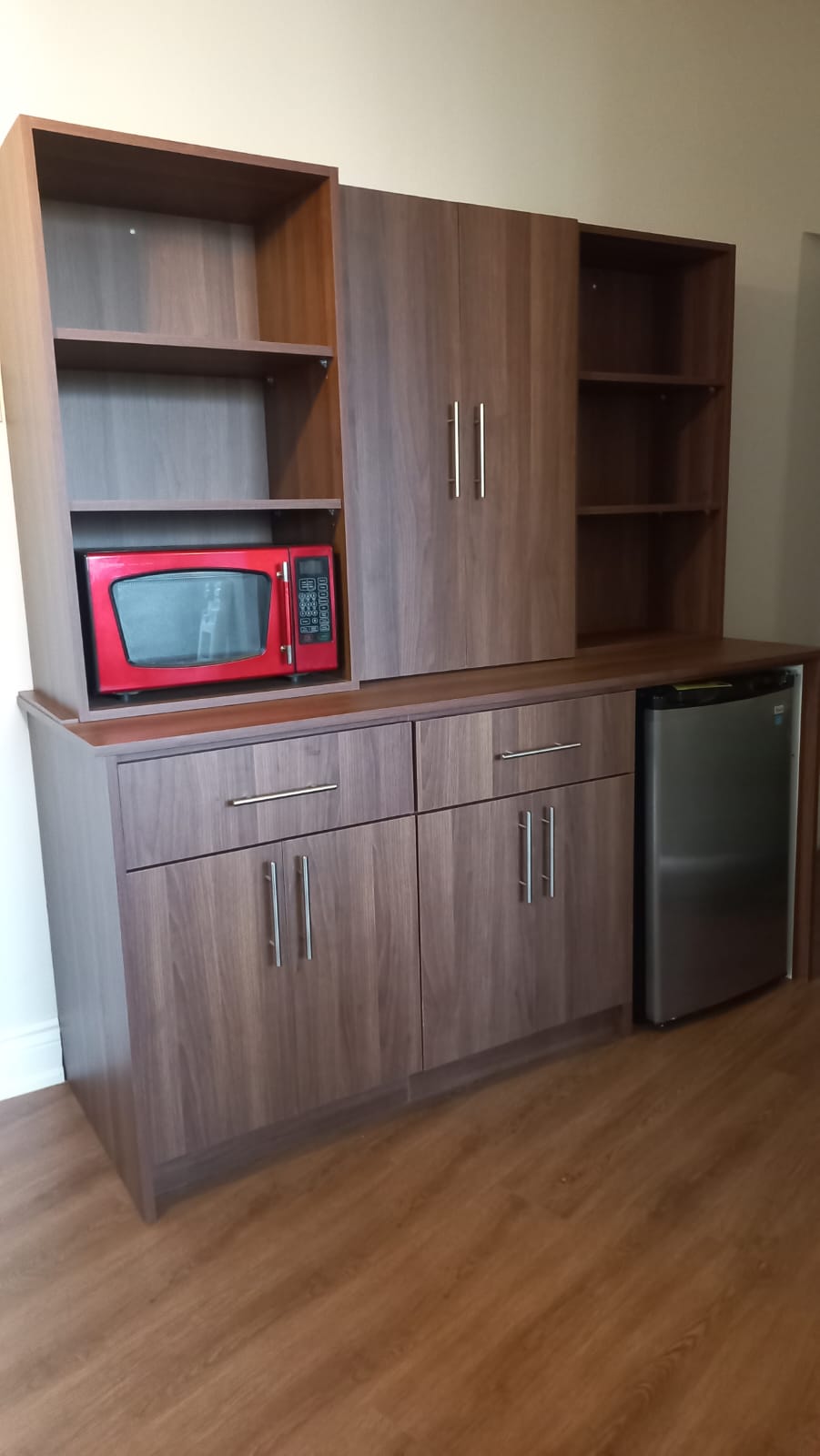 Kitchen pantry cabinet with microwave nook and fridge cutout